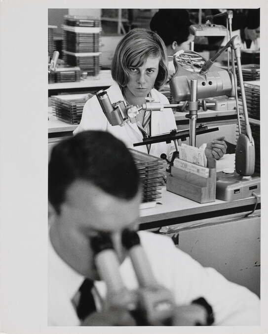 Woman seated at desk in IBM Factory, Mainz, West Germany