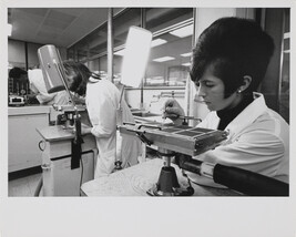 Woman working on machine at IBM factory, Mainz, West Germany