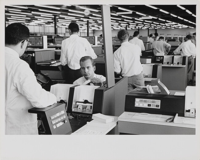 Men working in cubicles at IBM Factory, Mainz, West Germany