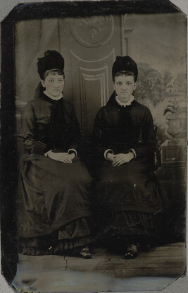 Studio Portrait of Two Seated Young Women