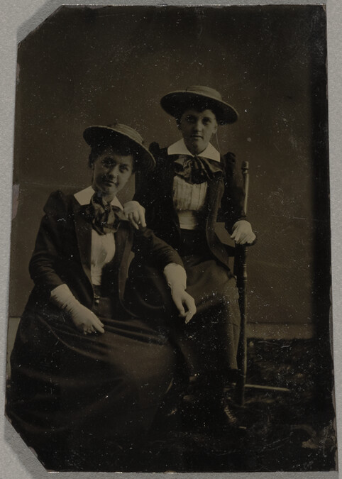 Studio Portrait of Two Seated Girls