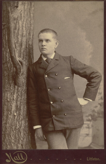 Young Man Leaning against a Tree