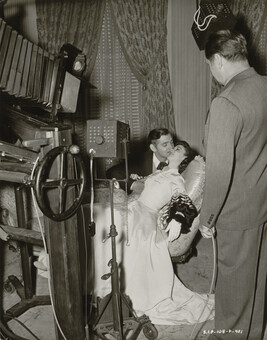 Clarence Sinclair Bull photographing Clark Gable and Vivian Liegh for Gone with the Wind,...