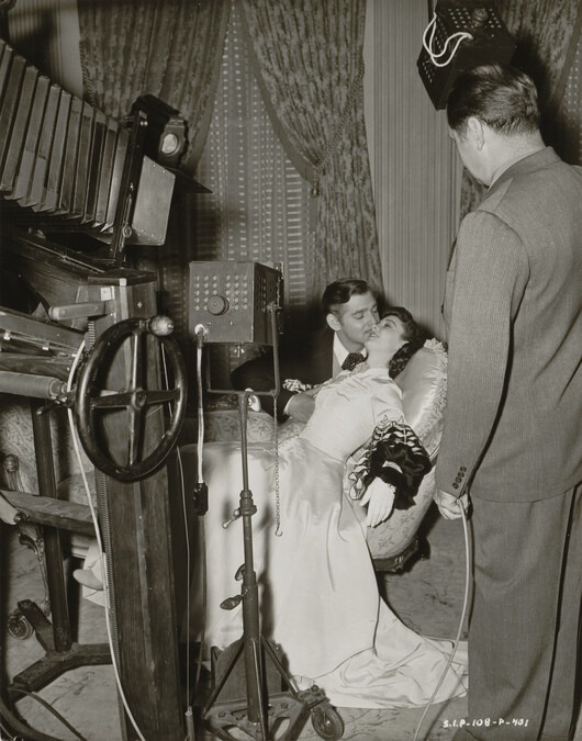 Clarence Sinclair Bull photographing Clark Gable and Vivian Liegh for Gone with the Wind, Metro-Goldwyn-Mayer