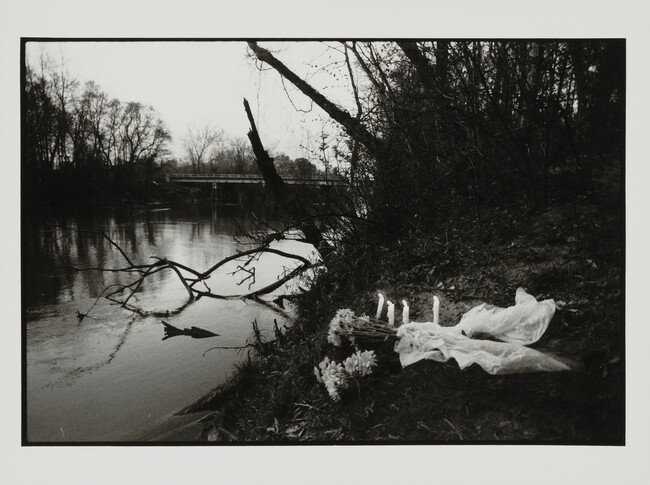 Candles and flowers on the site of 2 victims along the Chattahoochee River, Atlanta, Georgia