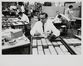 Man sorting cards at IBM factory, Mainz, West Germany