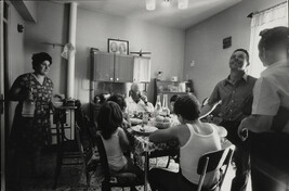 A family's celebration meal after participating in the marching band for the local Saints' Day festival,...