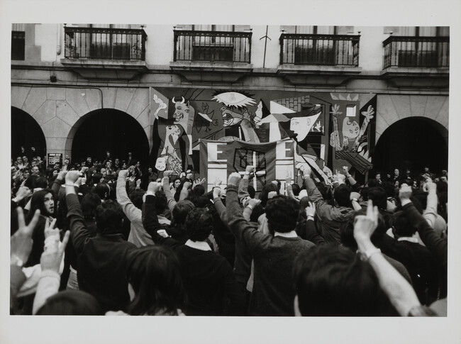 The Basque nationalist flag and thousands of supporters reunited in front of a reproduction of Picasso's mural, Guernica, Spain, 1977