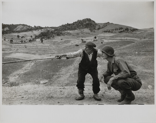 Sicilian peasant telling an American officer which way the Germans had gone.  Near Troina, Italy, August, 1943