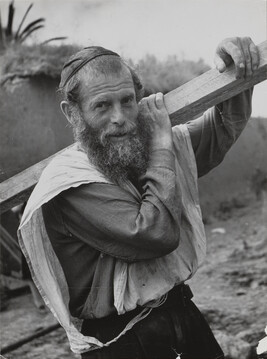 Face of Israel, a farmer with Orthodox beard and cap works to build homes and fertile fields in his new...