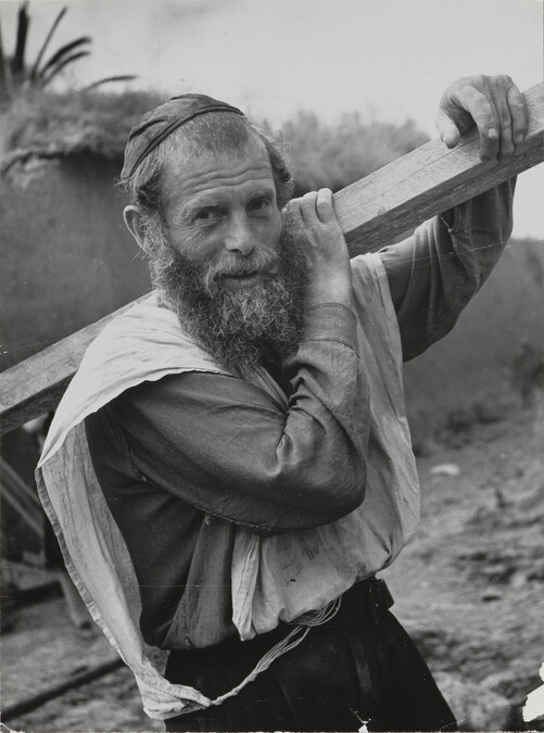 Face of Israel, a farmer with Orthodox beard and cap works to build homes and fertile fields in his new homeland