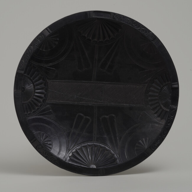Argillite Plate with Semi-Circular Compass Rose and Tobacco Leaf Motifs with a Cross Hatched Rectangle in the Center