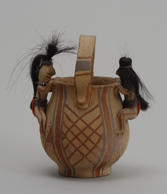 Handled Jar with Twin FIgurines astride opposite sides