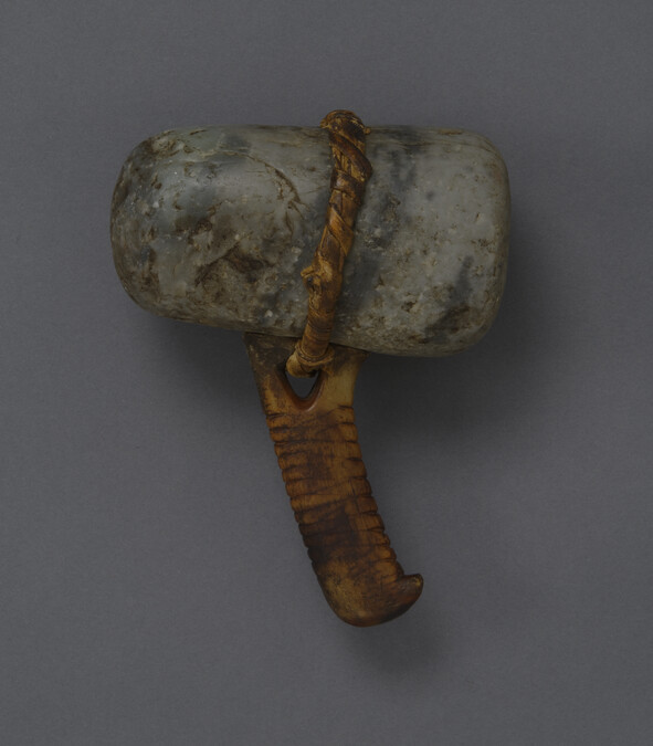 Stone maul with an ivory or antler handle