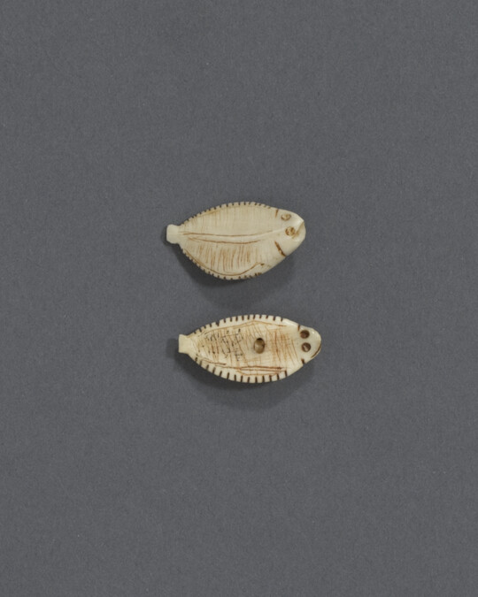 Two Ivory Buttons Carved to Represent Flounder
