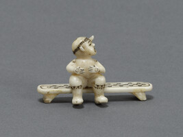 Miniature Carving of a Dancing Man Wearing a Loon Headdress (with beak)