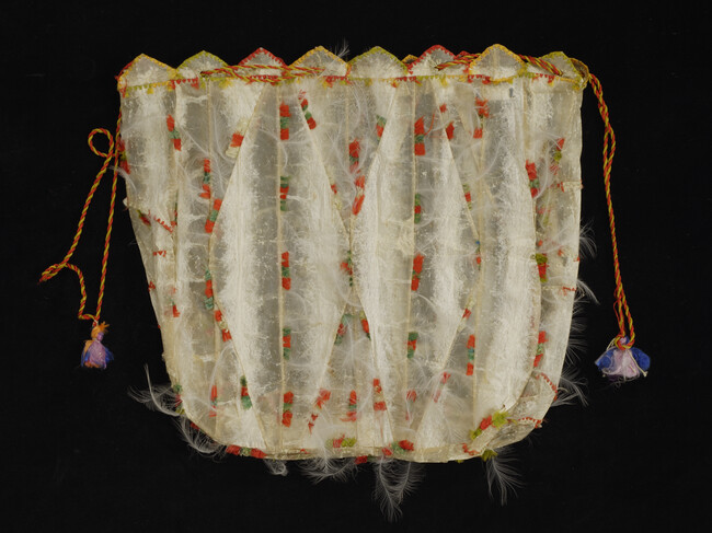 Bag made of Seal or Sea Lion Gut, with a silk draw string, decorated with silk thread and white feathers