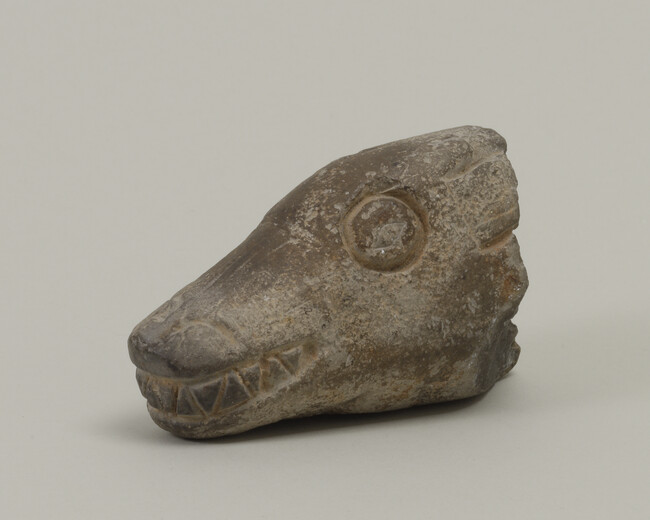 Stone fragment in form of a Wolf's Head.