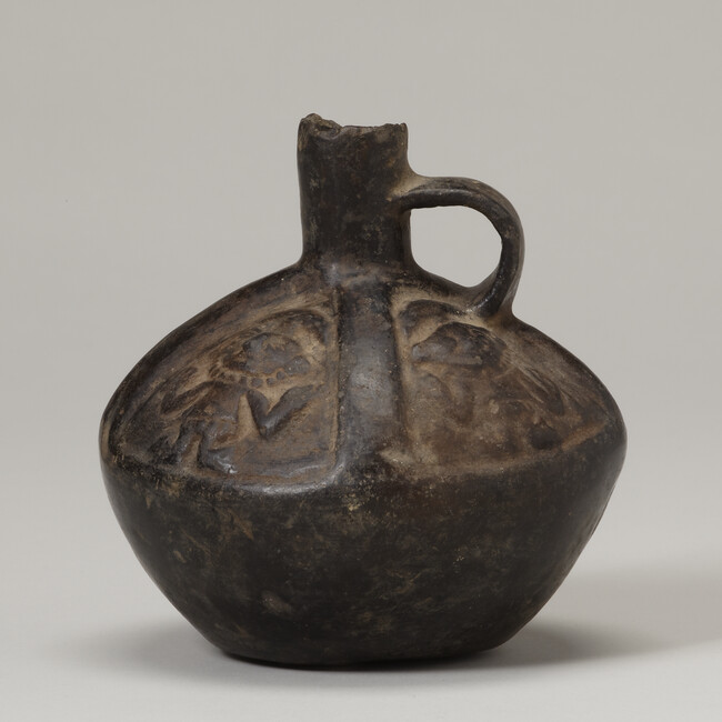 Vessel with a Relief of a Person wearing a Crescent Headdress