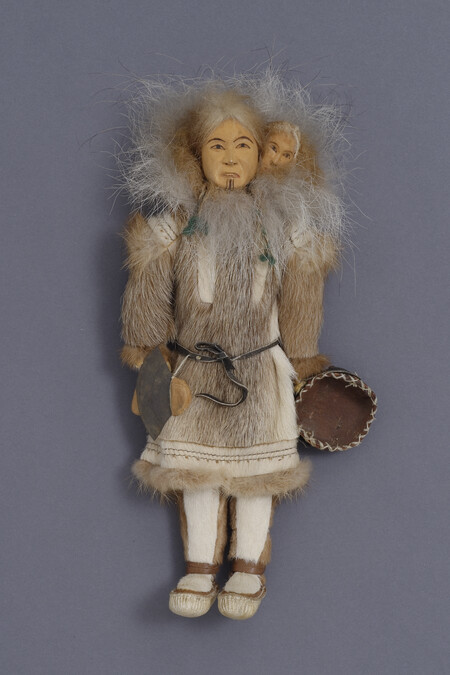 Doll representing an Iñupiaq Woman Carrying a Child on her Back, Holding an Ulu and Dish