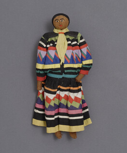 Doll representing a Seminole Man wearing a Long Shirt