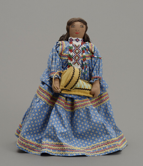 Doll representing an Apache Woman Carrying her Baby in a Cradleboard
