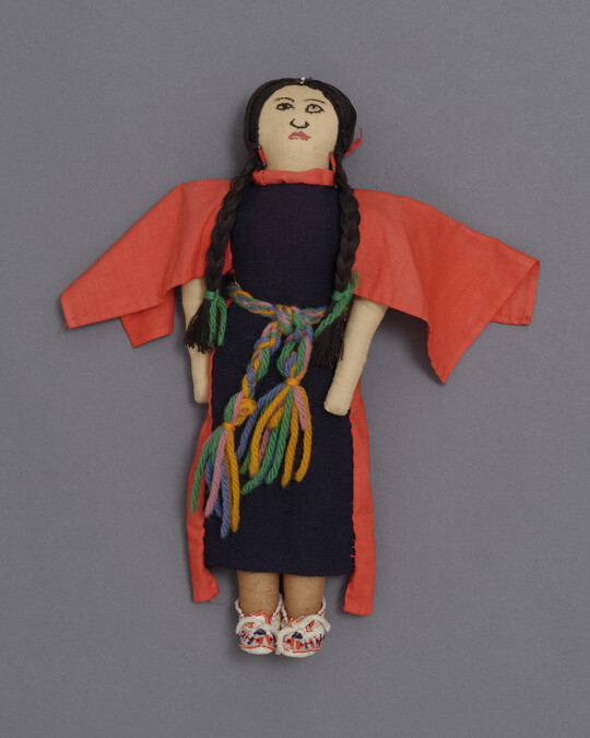 Doll representing a Ka'igwu Woman wearing a Battle Dress of the Ton-Kon-Ga (the Kiowa Black Leggings Society) in the 19th century