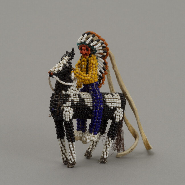 Doll representing an Inunaina Man and Horse
