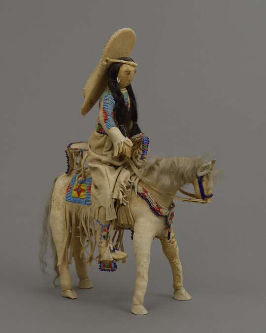 Doll representing a Shoshone Woman on a Horse with a Child in a Cradleboard