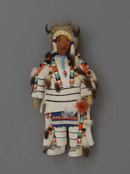 Doll representing an Assiniboine Chief dressed as a Buffalo Dancer