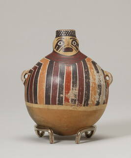 Face-Neck Bottle or Flask in the Form of a Person wearing a Striped Tunic