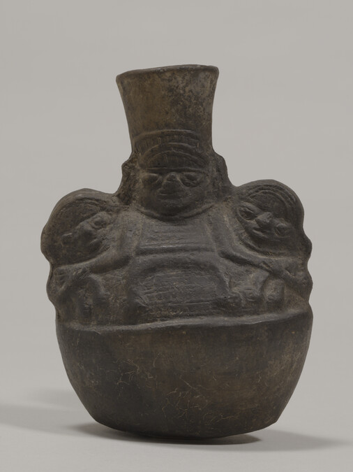 Bottle in the form of Three Figures wearing Headdresses