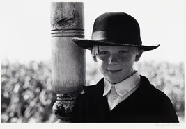 Amish Boy Leaning on Post
