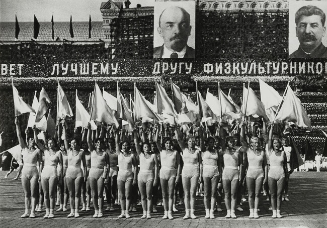 Women Paraders with Flags, Posters of Stalin and Lenin in Background