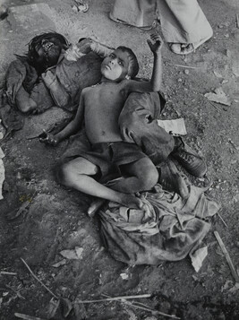 Indian Child and Sleeping Man on the Ground