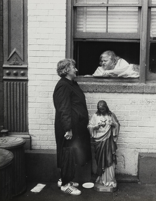 Two Women Talking with a Jesus Figure Below Window