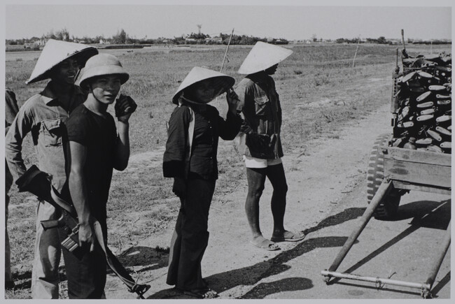 Viet Cong soldiers collecting weapons (left panel of panorama)