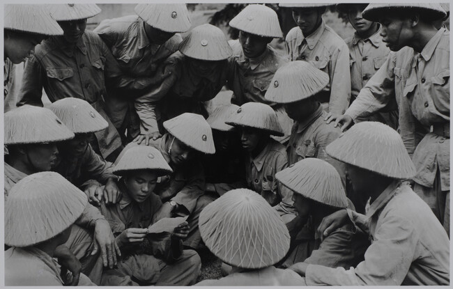 Vietnamese soldiers reading a letter