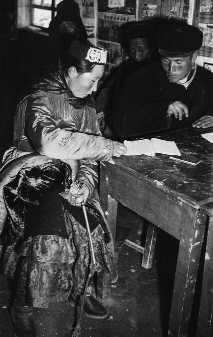 A bride and groom register for marriage, China