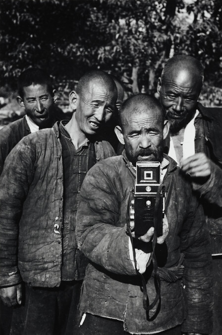 Chinese men with view camera