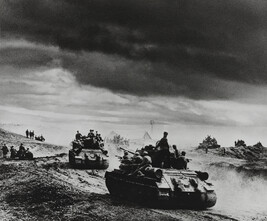 Rolling tanks under stormy skies