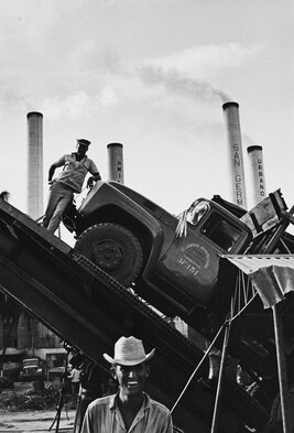 Men with truck and smokestacks, Cuba