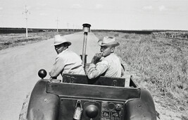 Two men in a tractor, Cuba