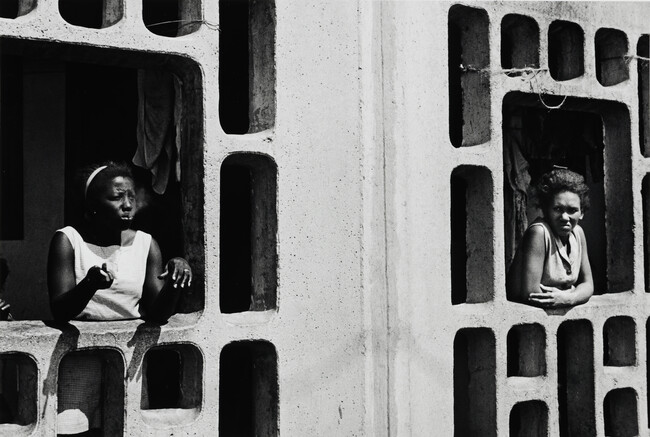 Cuban women in cinderblock structure