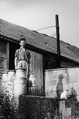 A man, a milkjug, a cat and a shadow: England