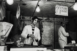 Meatseller at the open-air market, Rome, Italy