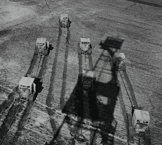 Harvesters with Shadow of Derrick