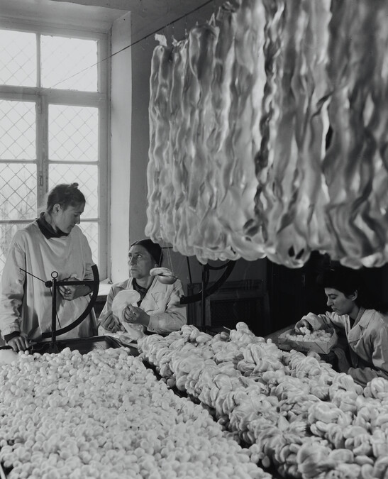 Textile Workers with Skeins of Yarn