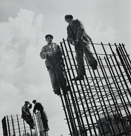 Construction Workers with Rebar Towers