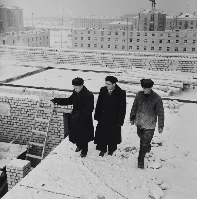 Three Men on a Snowy Rooftop